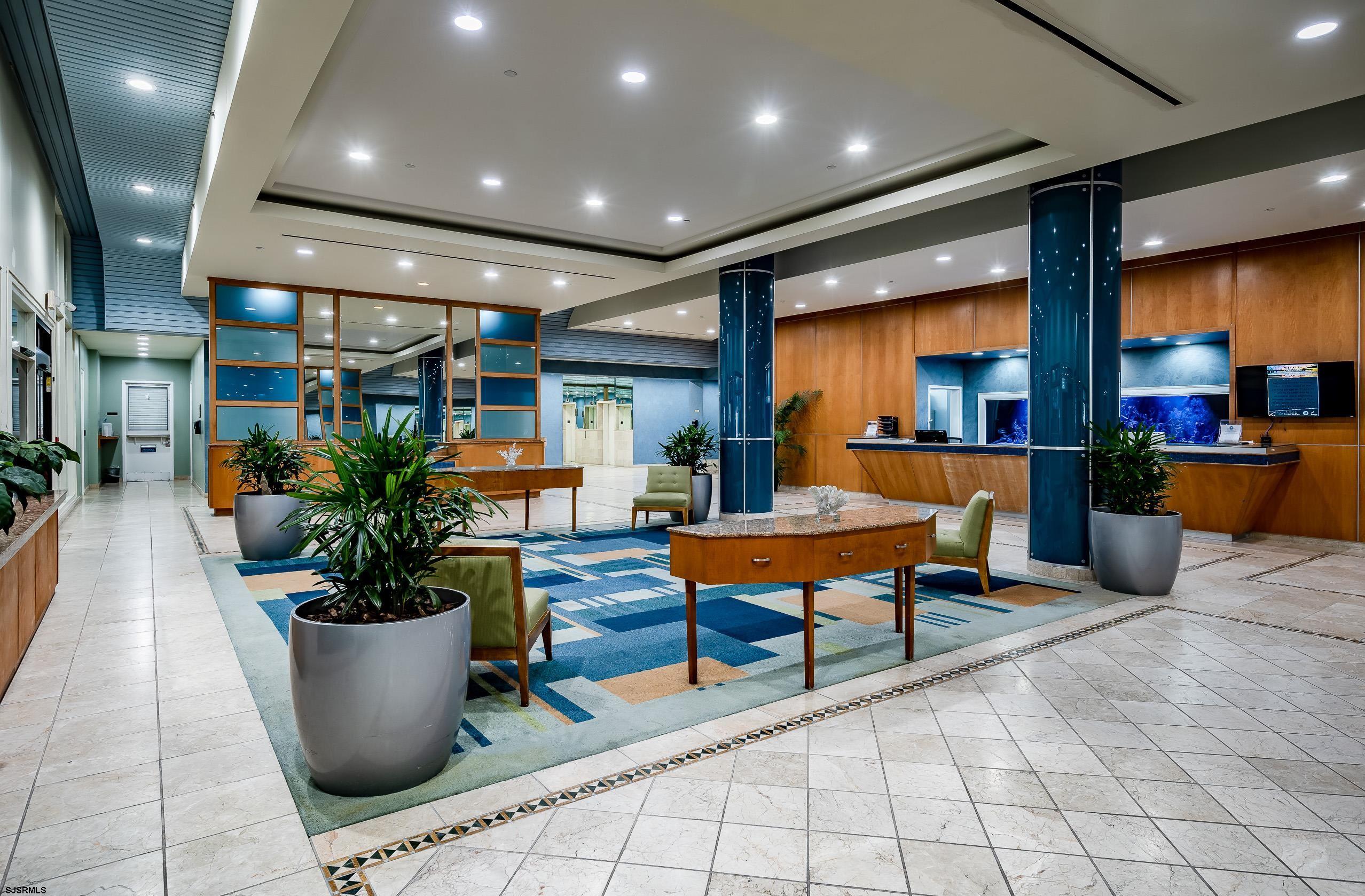 3101 Boardwalk, Unit CONDO Atlantic City, NJ 08401 - Photo 35 of 46 a lobby with furniture and a potted plant