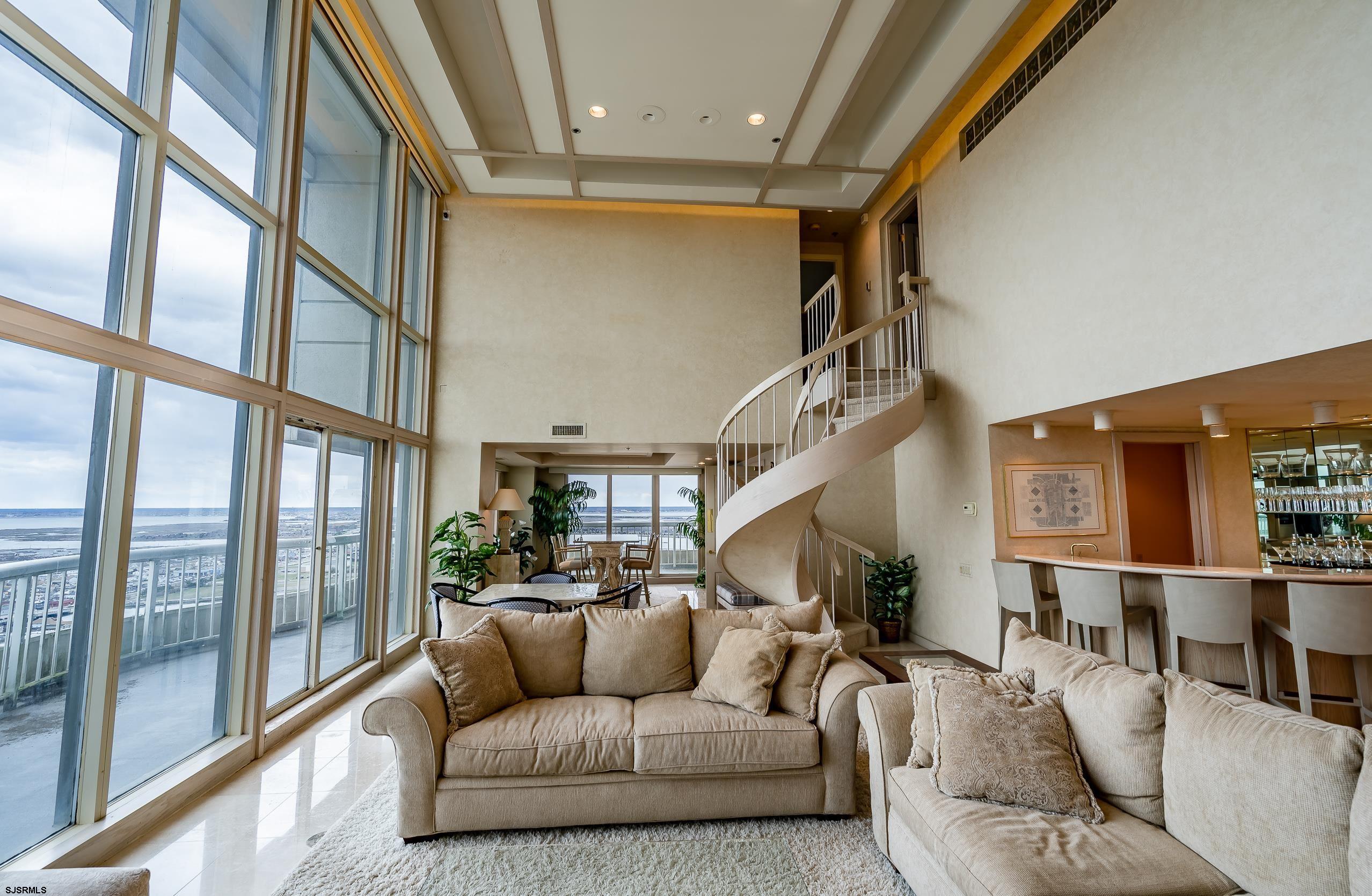 3101 Boardwalk, Unit CONDO Atlantic City, NJ 08401 - Photo 7 of 46 a living room with furniture and a large window