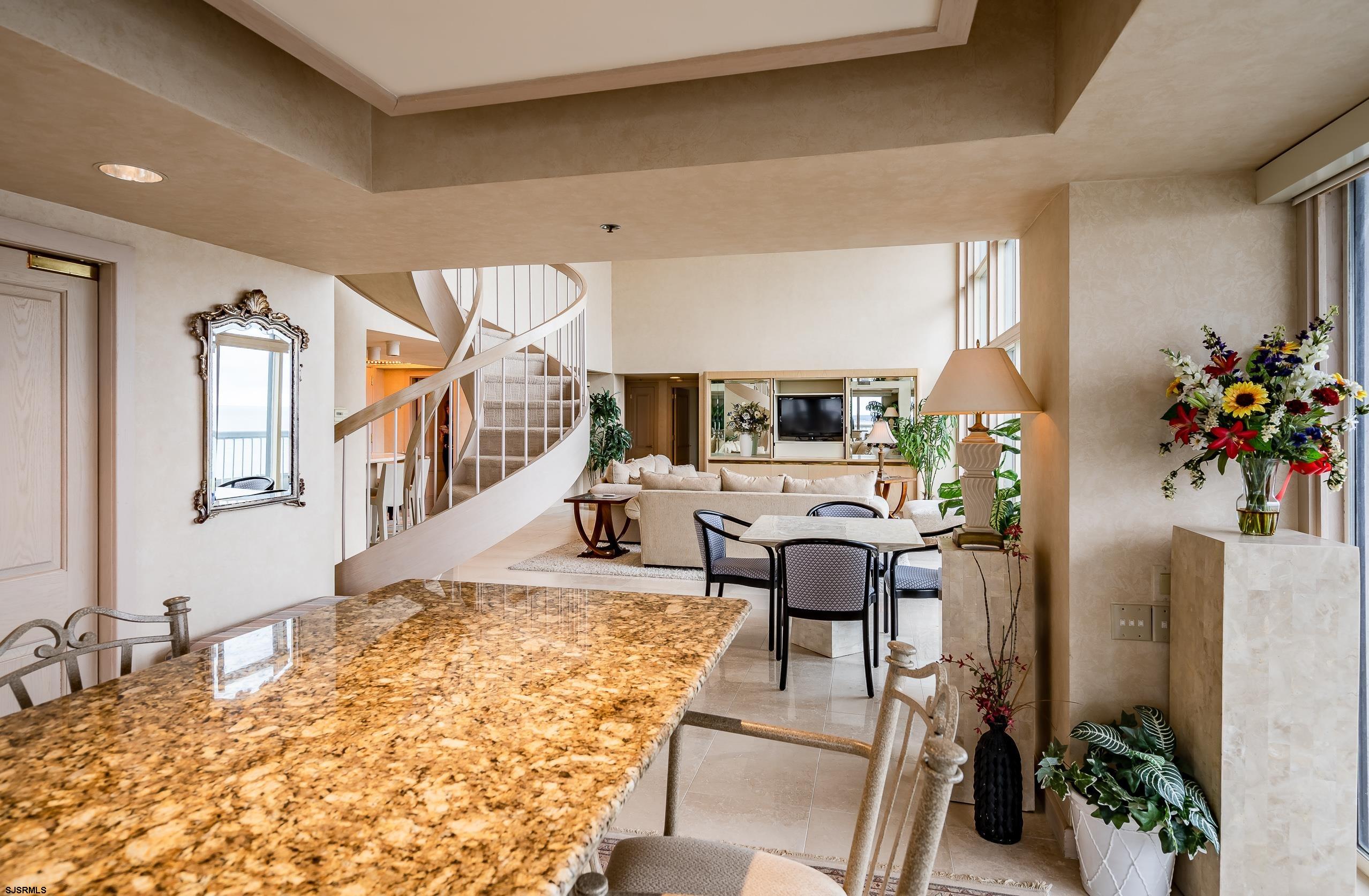 3101 Boardwalk, Unit CONDO Atlantic City, NJ 08401 - Photo 9 of 46 a living room with furniture fireplace and potted plant