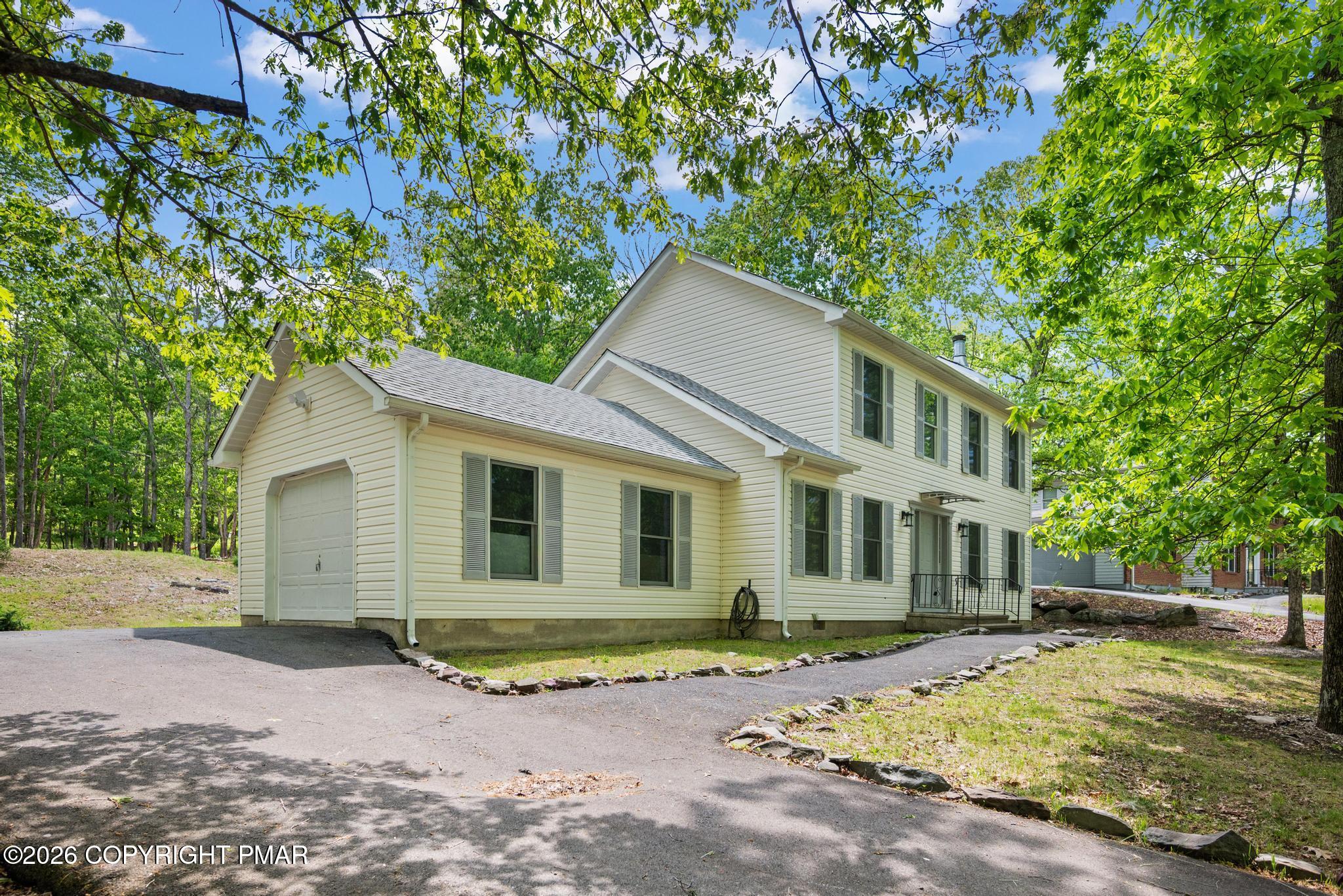 2312 Cramer Court Bushkill, PA 18324 - Photo 4 of 37 a view of a house with a tree in the background