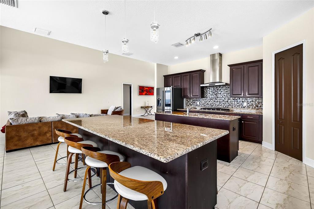 3532 West Shell Point Road Ruskin, FL 33570 - Photo 11 of 40 a kitchen with a table and chairs in it