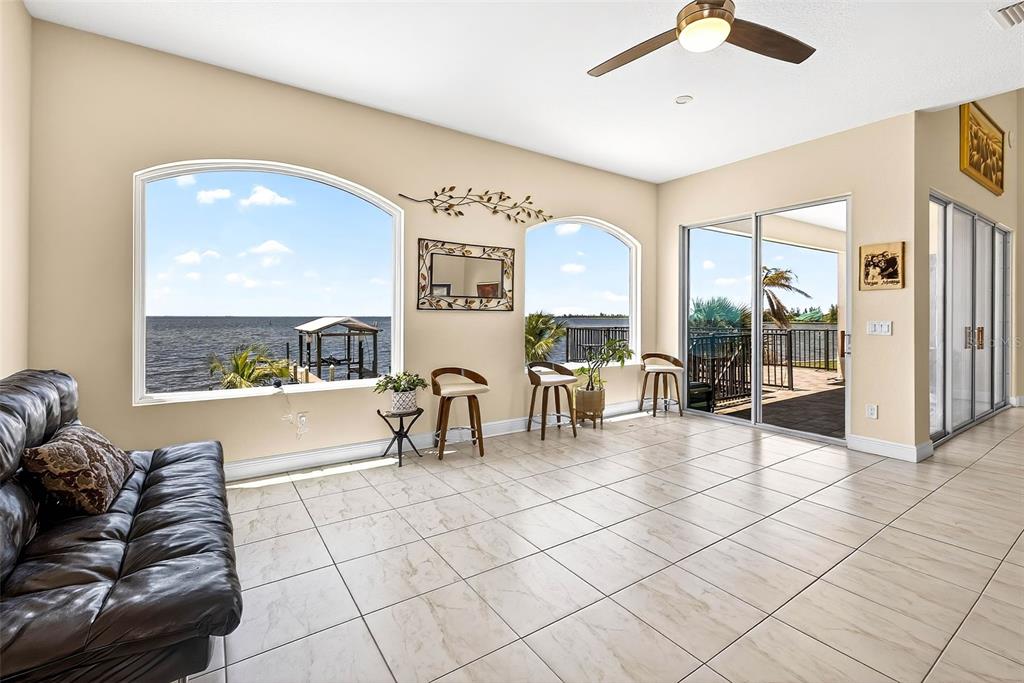 3532 West Shell Point Road Ruskin, FL 33570 - Photo 13 of 40 a living room with furniture and a large window