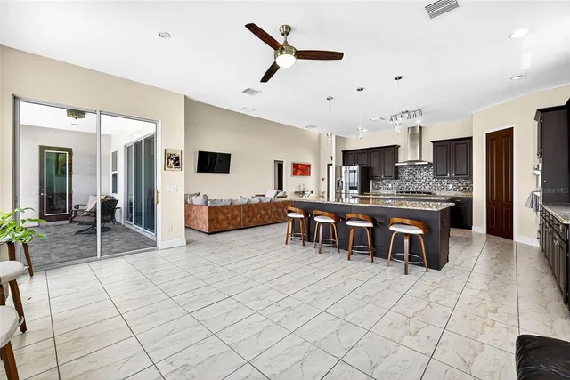 a view of a kitchen and dining room