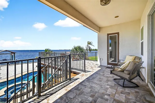 a view of a balcony with furniture