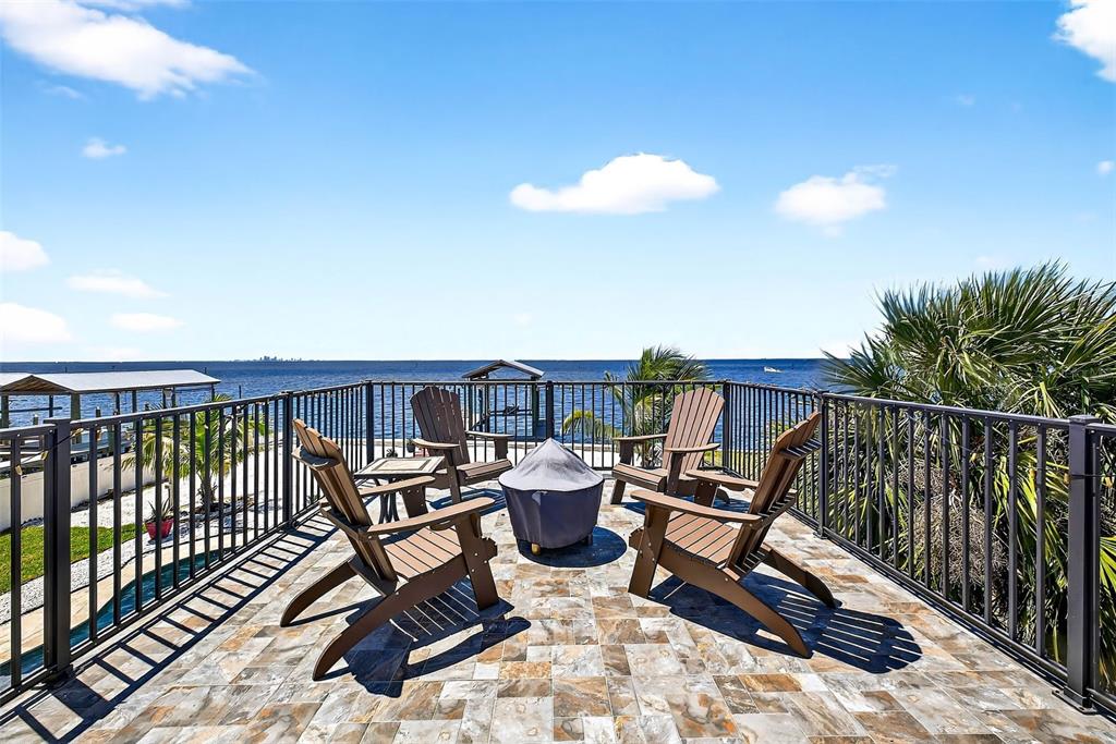 3532 West Shell Point Road Ruskin, FL 33570 - Photo 16 of 40 a view of a roof deck with wooden floor and fence