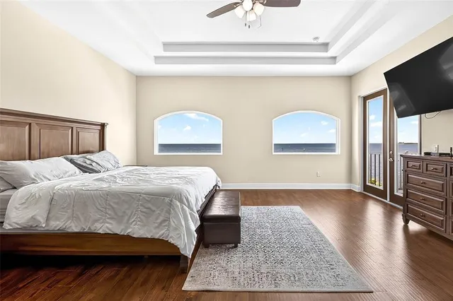 a bedroom with a bed and flat screen tv