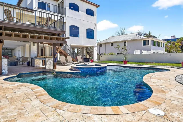 a view of a house with swimming pool