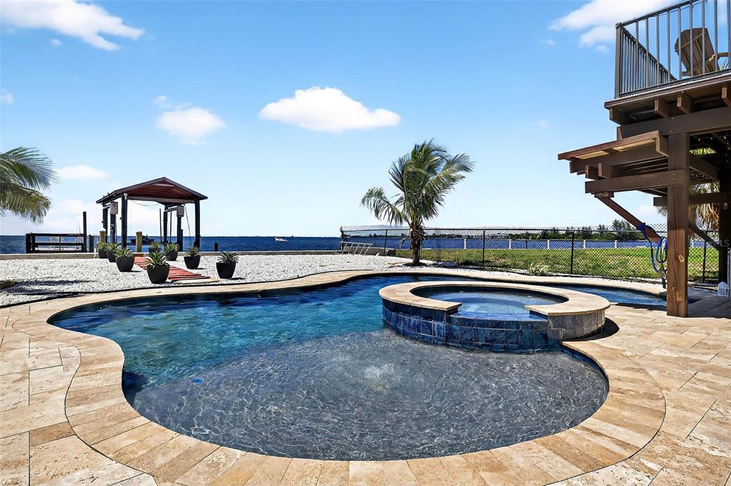 3532 West Shell Point Road Ruskin, FL 33570 - Photo 31 of 40 a view of a swimming pool with lounge chair