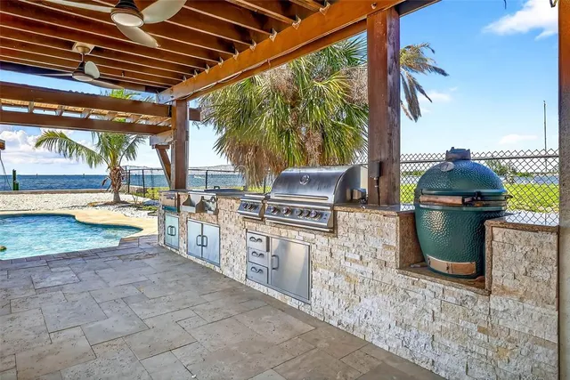 a view of a balcony with lake view and wooden floor