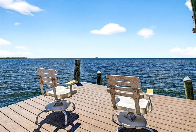 a view of swimming pool with outdoor seating