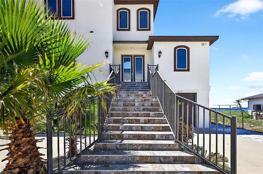 3532 West Shell Point Road Ruskin, FL 33570 - Photo 40 of 40 a view of a house with a flower garden
