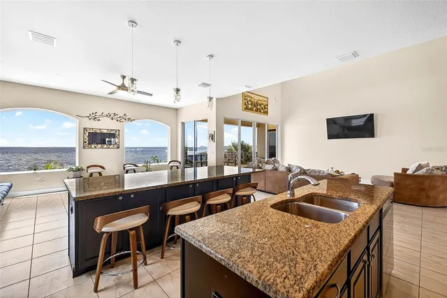 a kitchen with a table chairs and a refrigerator