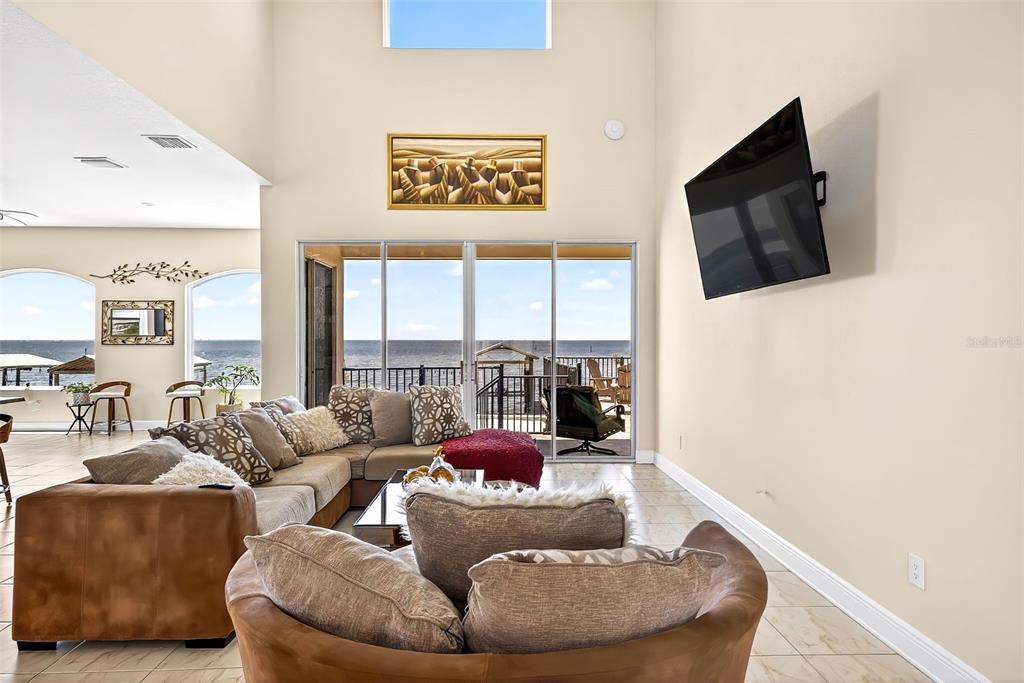 3532 West Shell Point Road Ruskin, FL 33570 - Photo 8 of 40 a living room with furniture and a flat screen tv