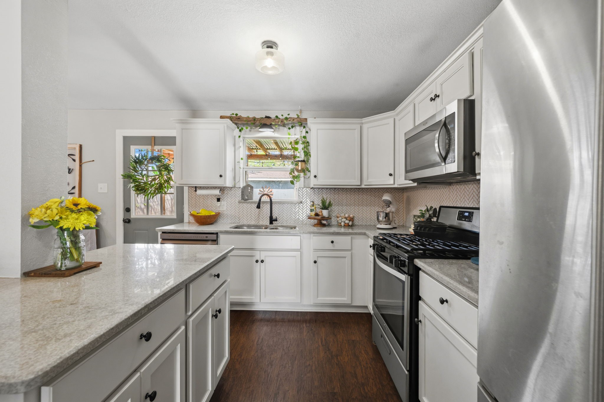431 Corydon Drive Houston, TX 77336 - Photo 13 of 26 Well-appointed kitchen featuring stainless steel appliances, including a gas range, dishwasher, and built-in microwave. Ample prep space and the thoughtful layout ensures easy movement between cooking, dining, and entertaining.
