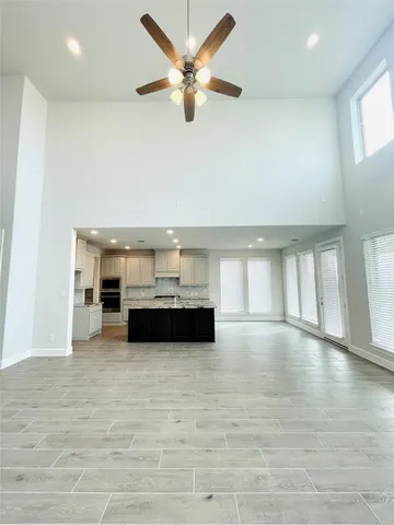 a spacious bathroom with a double vanity sink and a mirror