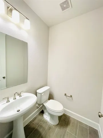 a view of a bathroom with a tub and mirror