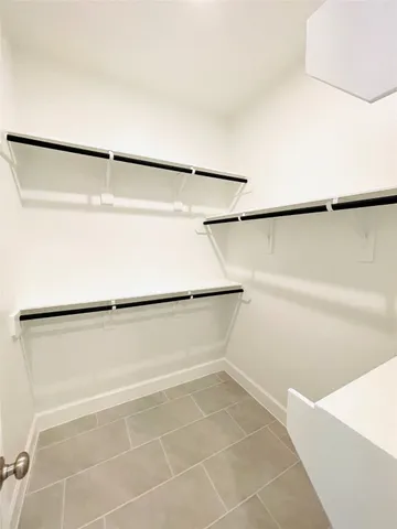 a bathroom with a tub and shower