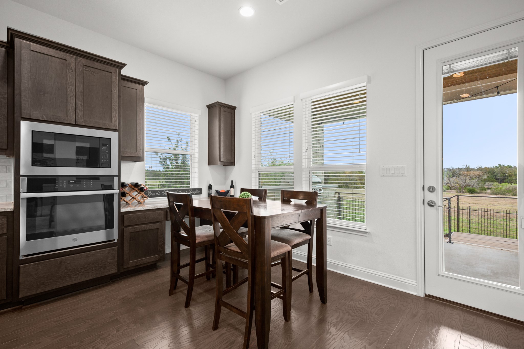 330 Cistern Way Austin, TX 78737 - Photo 14 of 40 a view of a dining room with furniture and window
