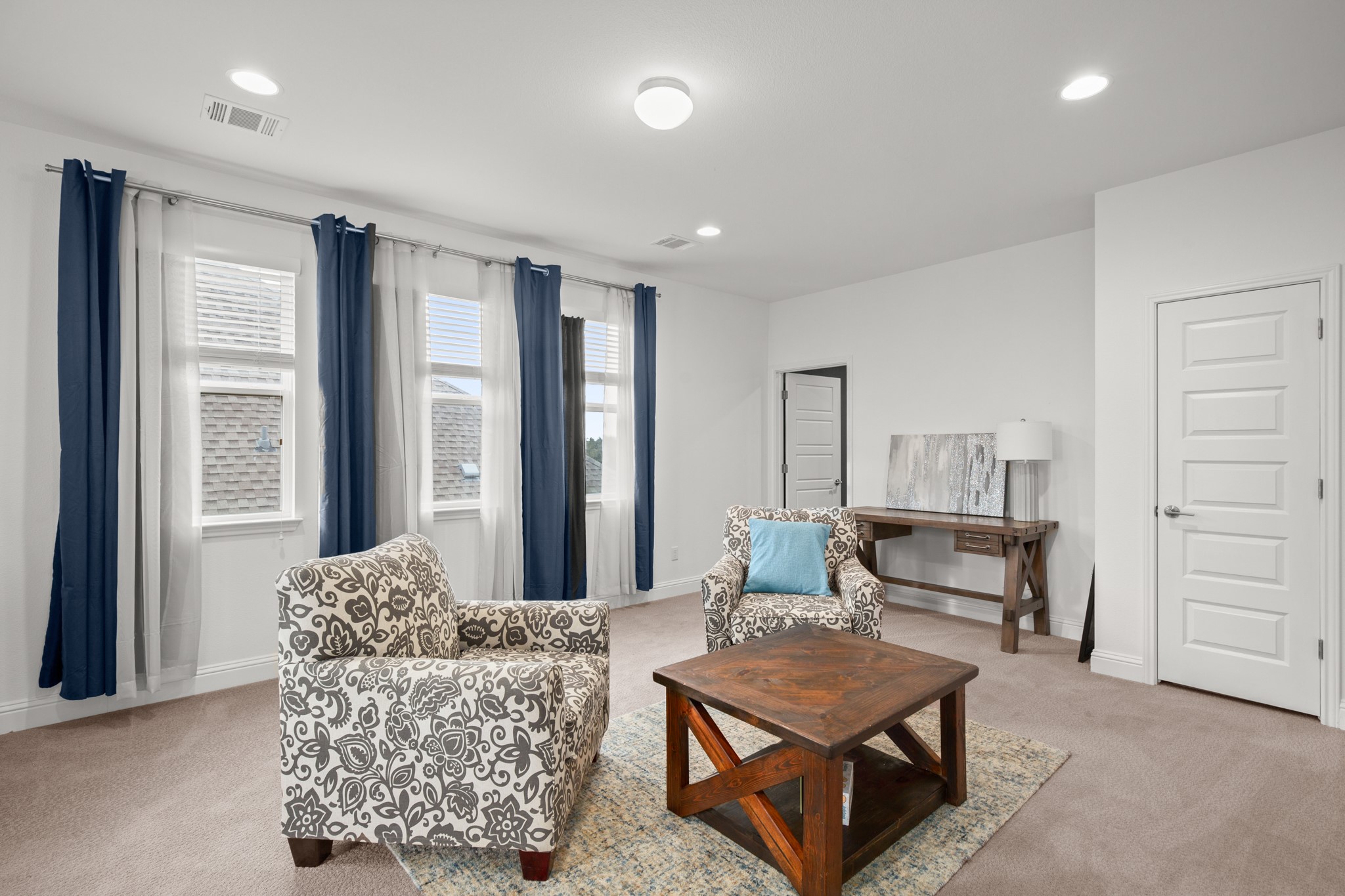 330 Cistern Way Austin, TX 78737 - Photo 28 of 40 a living room with furniture a table and a painting