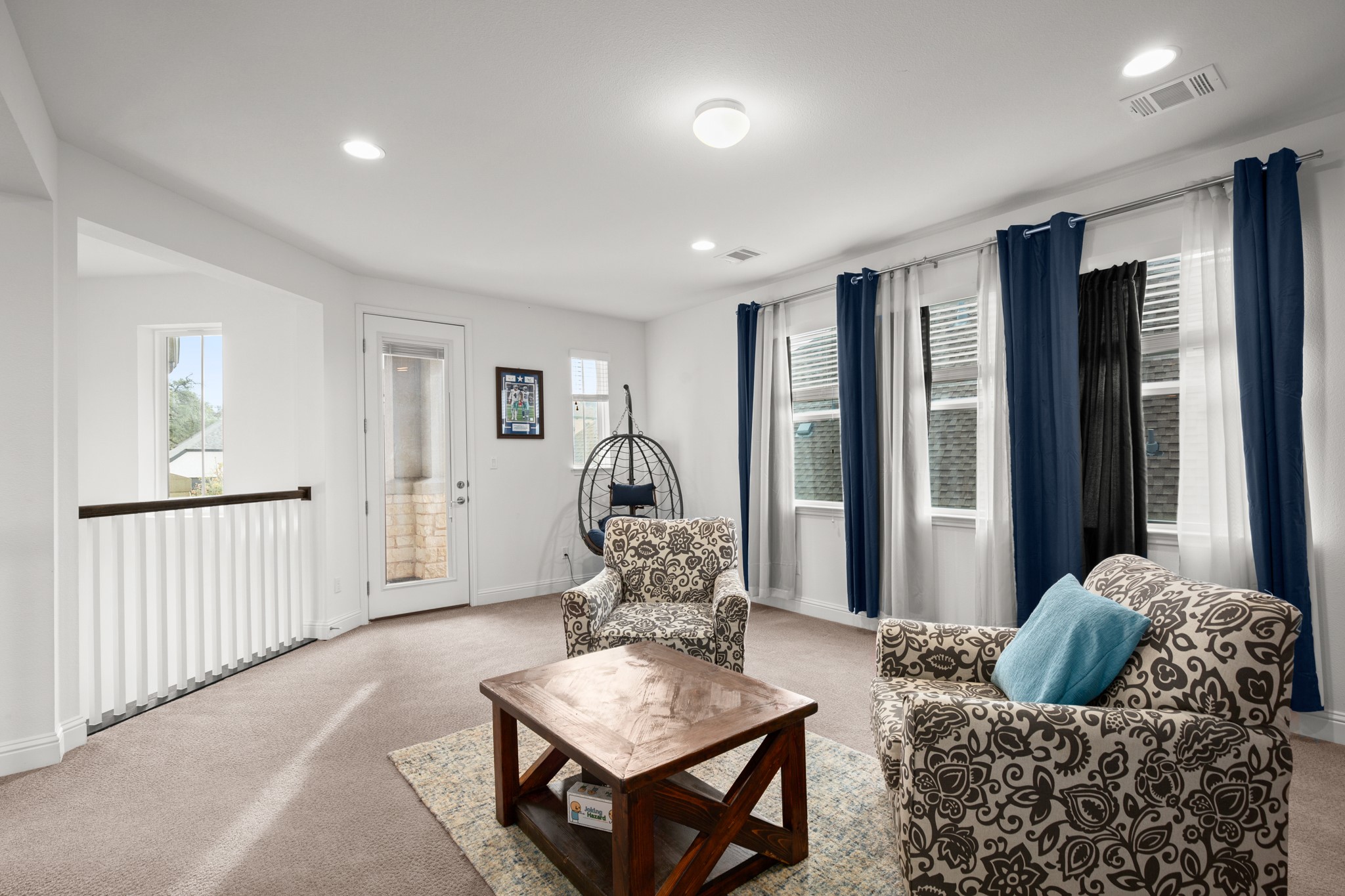 330 Cistern Way Austin, TX 78737 - Photo 29 of 40 a living room with furniture and a large window