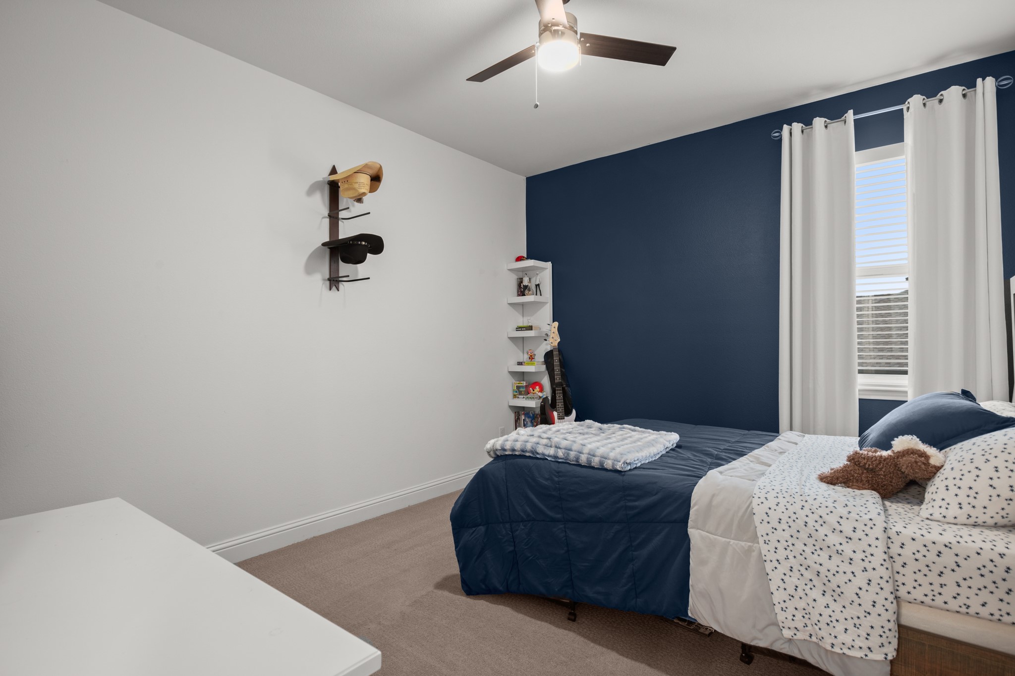 330 Cistern Way Austin, TX 78737 - Photo 32 of 40 a bedroom with a bed and a window