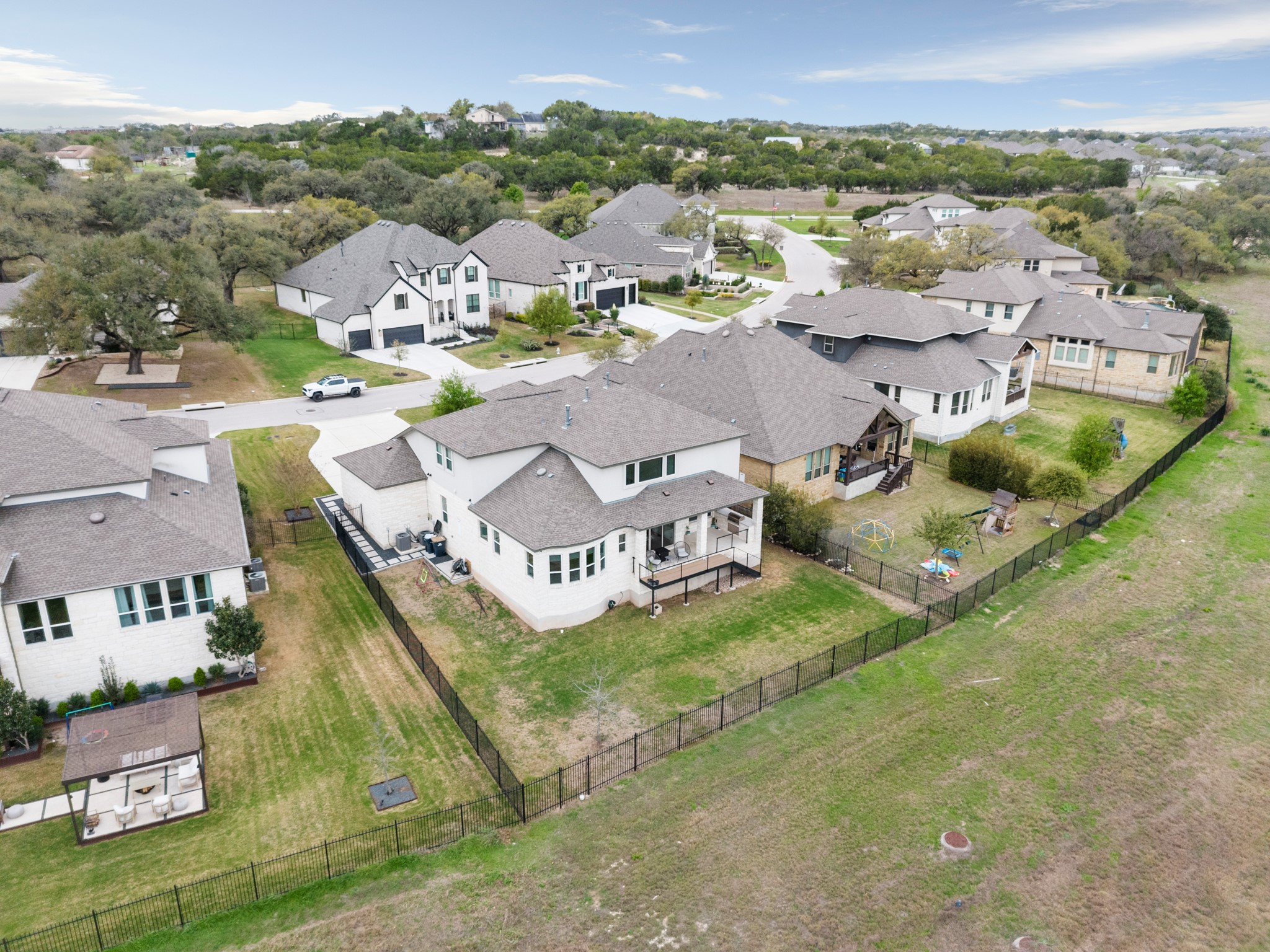 330 Cistern Way Austin, TX 78737 - Photo 40 of 40 an aerial view of residential houses with outdoor space and parking