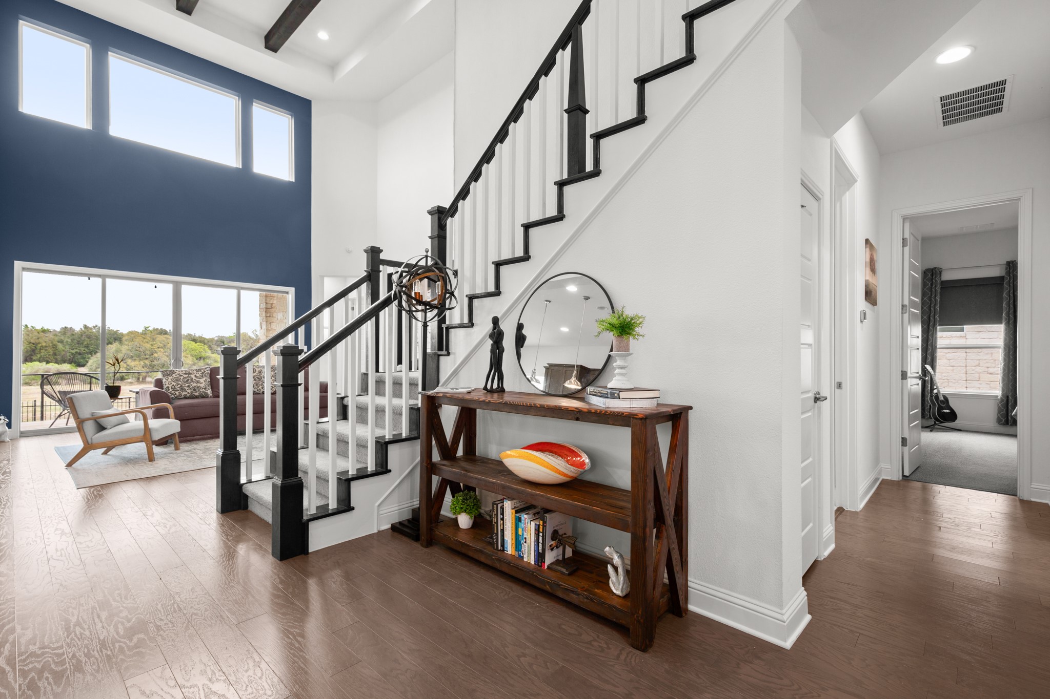 330 Cistern Way Austin, TX 78737 - Photo 6 of 40 a living room with lots of furniture and stairs