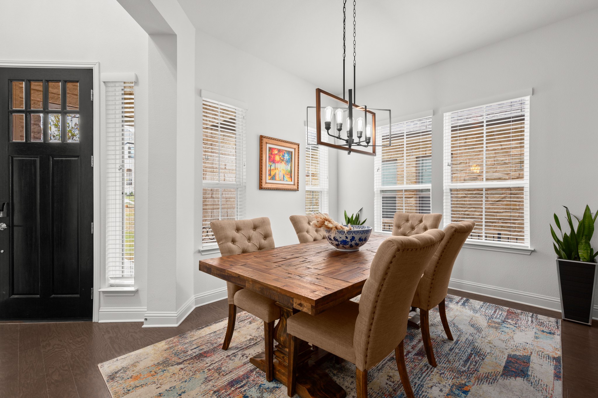 330 Cistern Way Austin, TX 78737 - Photo 8 of 40 a view of a dining room with furniture window and wooden floor