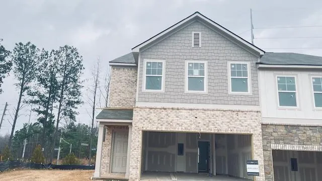 a view of a kitchen with a sink and a refrigerator