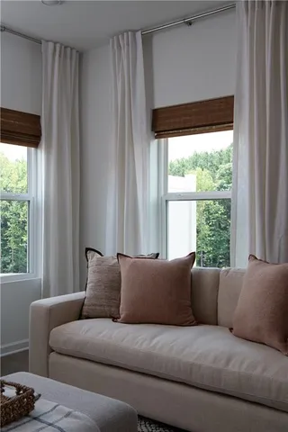 a living room with a couch and a large window