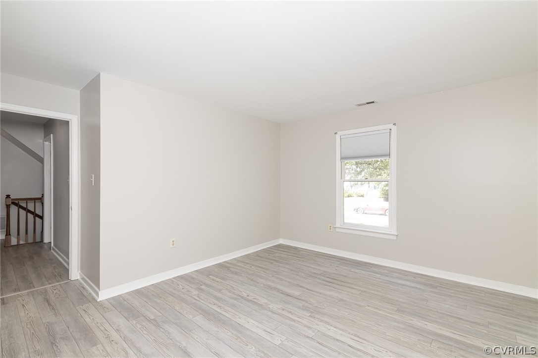 5505 Chestnut Bluff Road Midlothian, VA 23112 - Photo 36 of 44 an empty room with wooden floor and windows