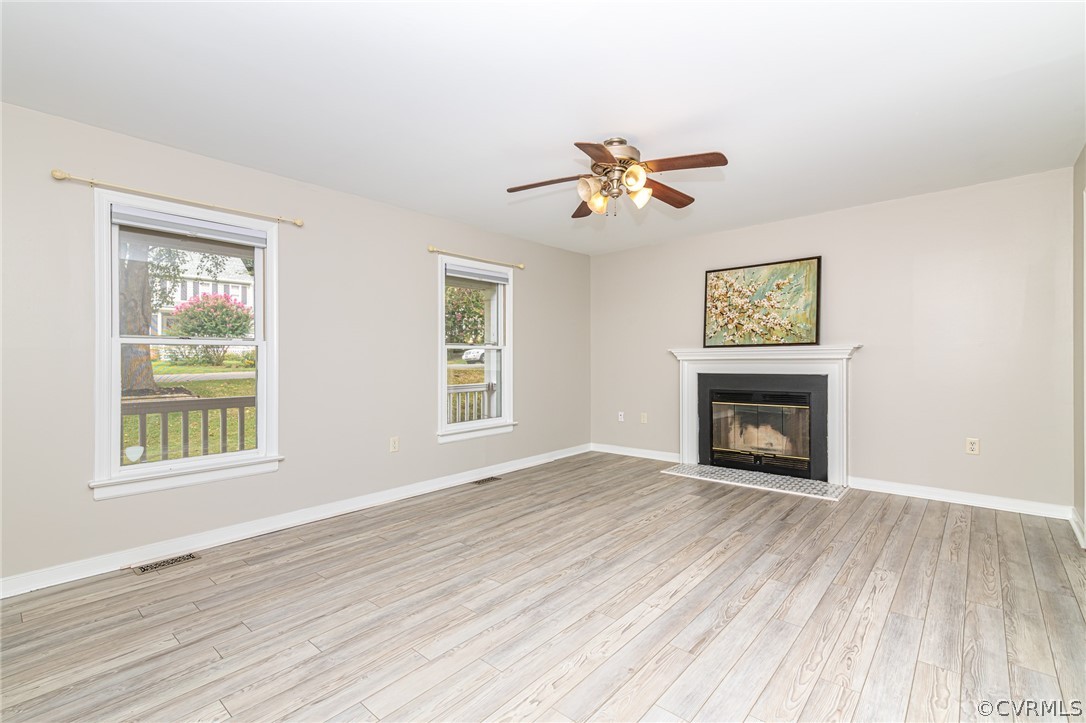 5505 Chestnut Bluff Road Midlothian, VA 23112 - Photo 10 of 44 a view of an empty room with a window and a fireplace