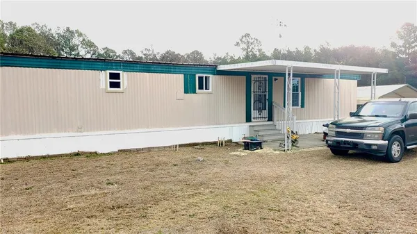 an outdoor view of house with yard