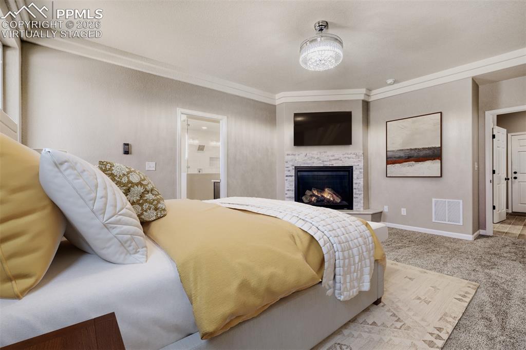 13680 Woodlake Road Elbert, CO 80106 - Photo 20 of 47 Virtually staged primary Bedroom with fireplace, massive closet, lux 5-piece bath