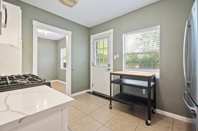 a bedroom with a bed and a table in it