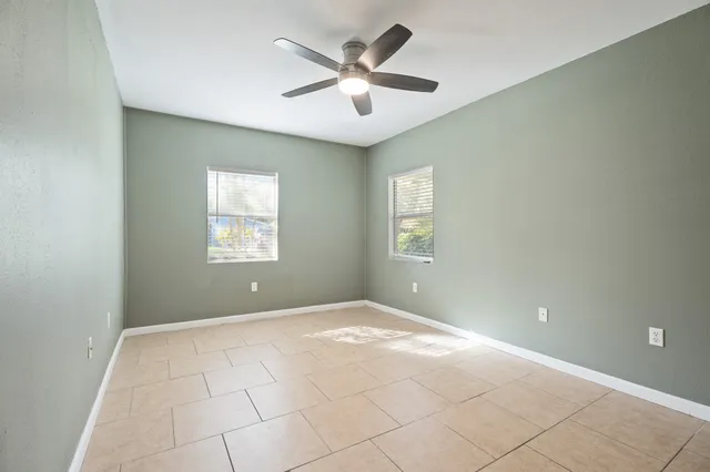a view of an empty room with a window