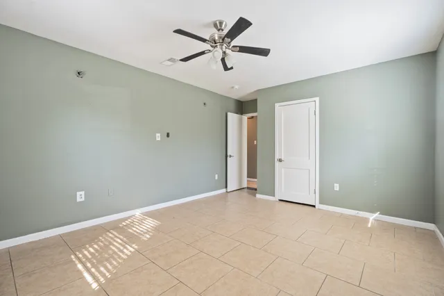 a view of a park with large trees