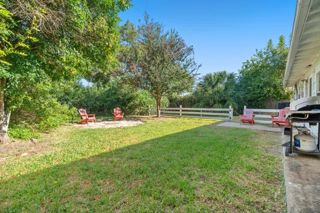 a view of a house with swimming pool and porch with furniture
