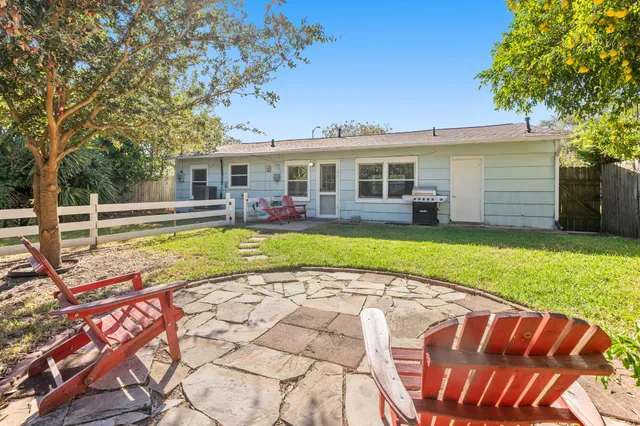 a view of a back yard of the house