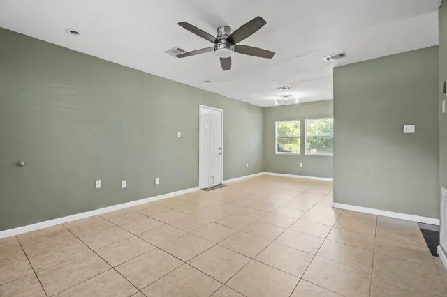 a view of an empty room and window