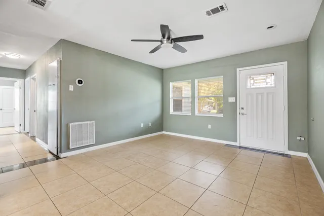 a view of an empty room with a window