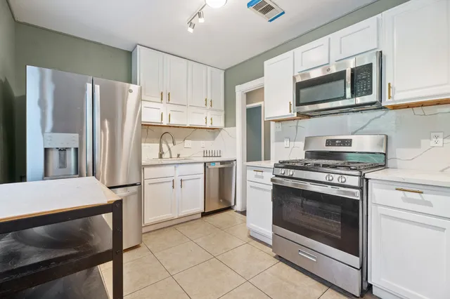 a kitchen with a stove microwave and refrigerator