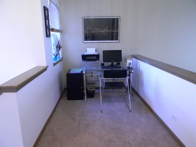 277 Grand Ridge Road, Unit 277 St. Charles, IL 60175 - Photo 12 of 13 a view of a workspace with furniture