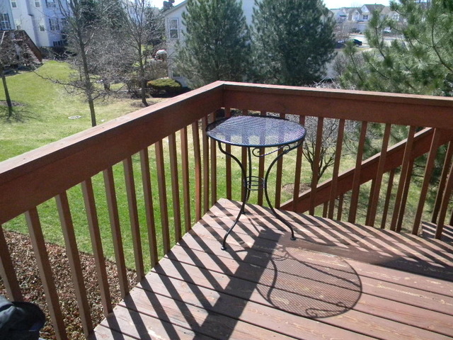 277 Grand Ridge Road, Unit 277 St. Charles, IL 60175 - Photo 13 of 13 a view of a balcony with wooden floor