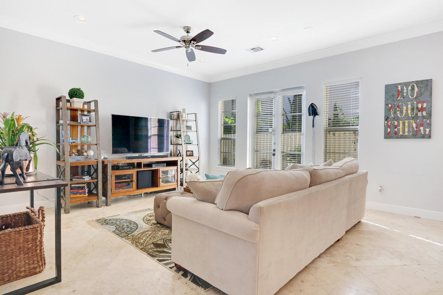 98 Via Poinciana Lane Boca Raton, FL 33487 - Photo 15 of 38 a living room with furniture and a flat screen tv