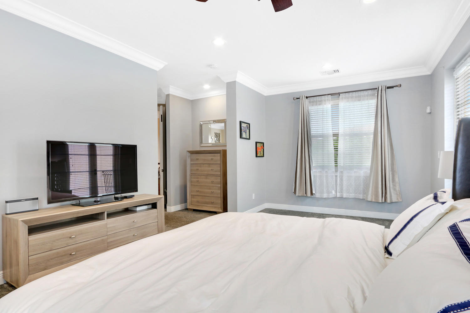 98 Via Poinciana Lane Boca Raton, FL 33487 - Photo 19 of 38 a view of a room with bed and tv