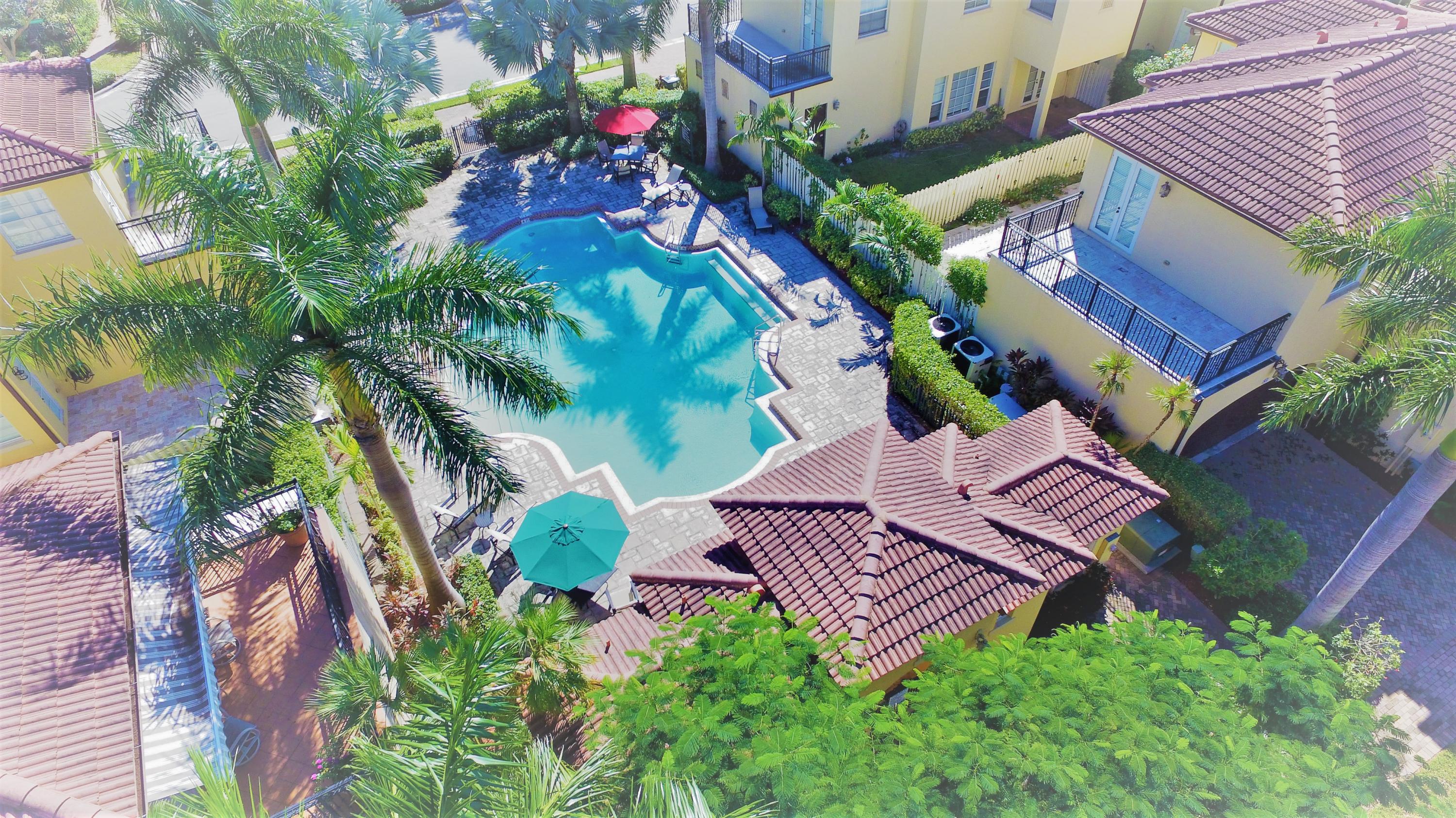 98 Via Poinciana Lane Boca Raton, FL 33487 - Photo 2 of 38 an aerial view of a house with garden space and street view