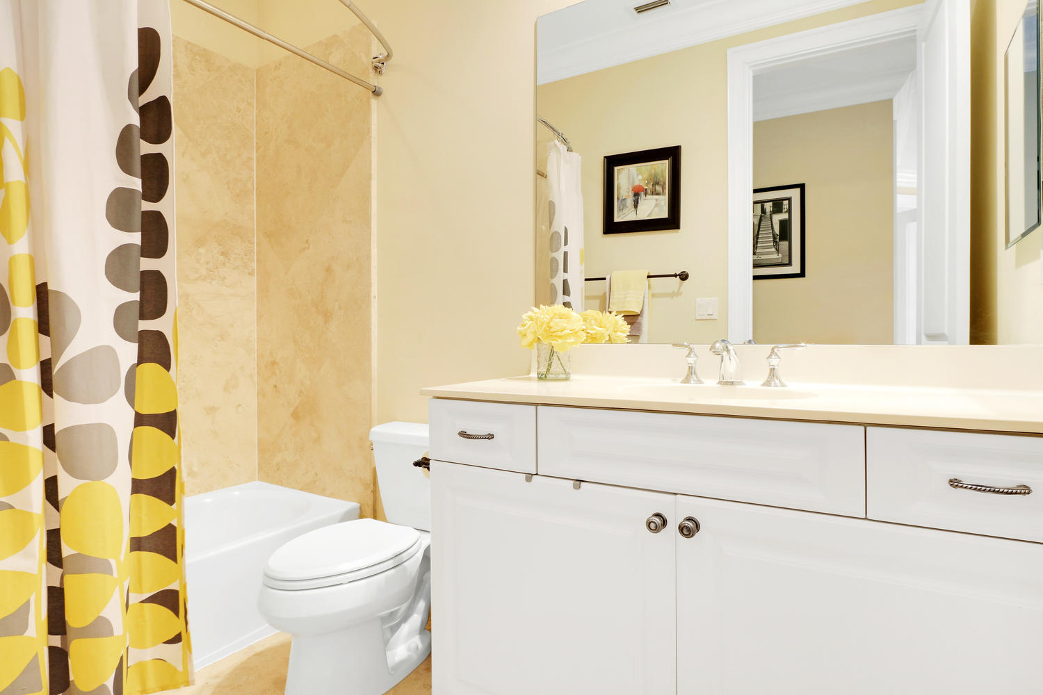 98 Via Poinciana Lane Boca Raton, FL 33487 - Photo 25 of 38 a bathroom with a sink mirror vanity and toilet