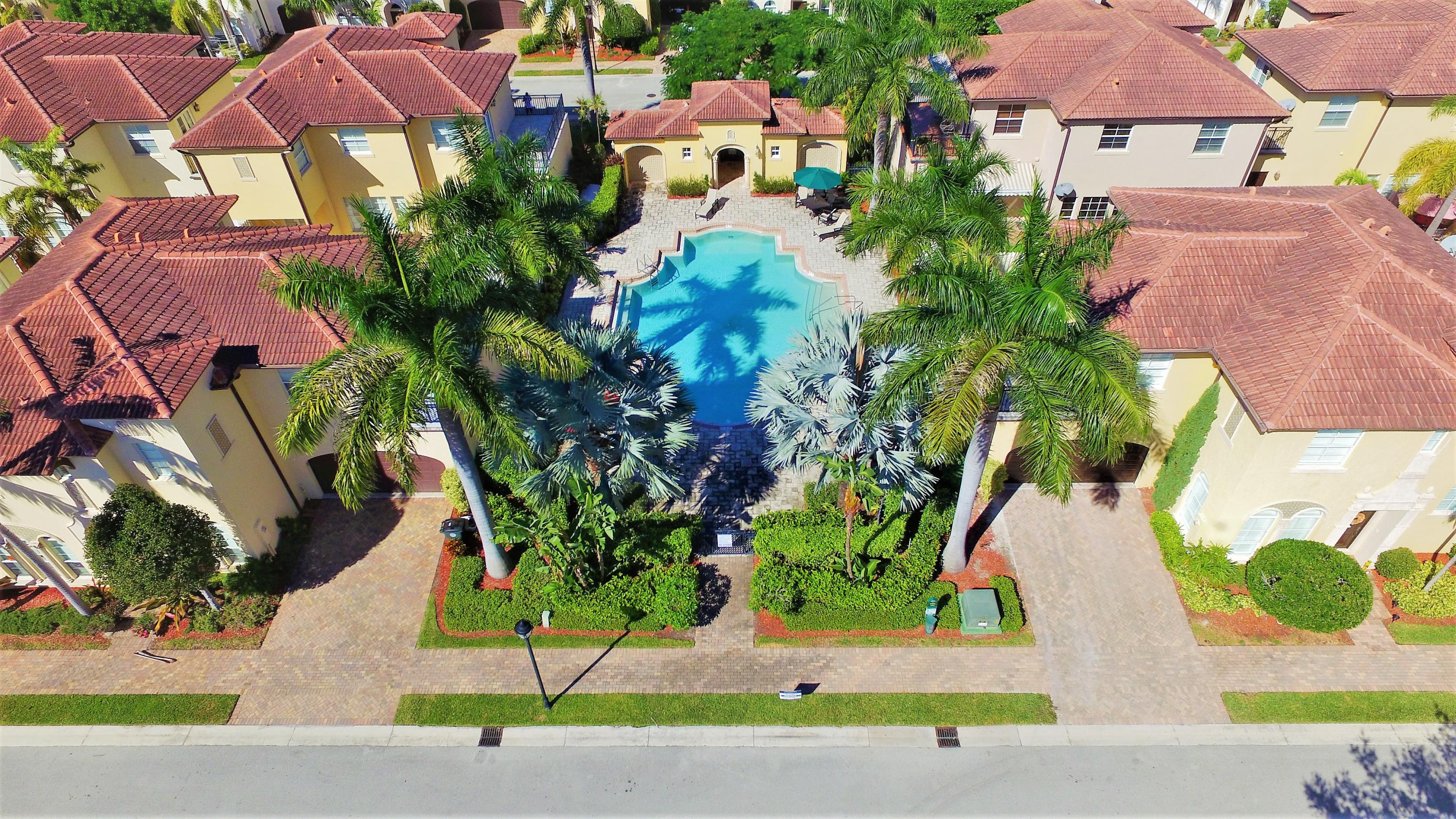 98 Via Poinciana Lane Boca Raton, FL 33487 - Photo 27 of 38 an aerial view of a houses with yard