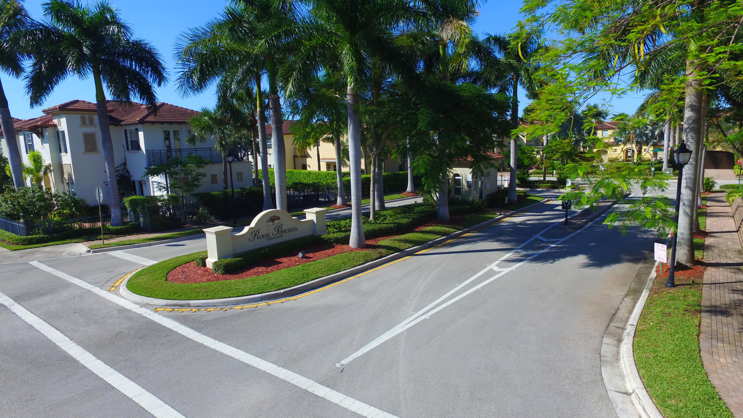 98 Via Poinciana Lane Boca Raton, FL 33487 - Photo 3 of 38 a swimming pool with outdoor seating and yard